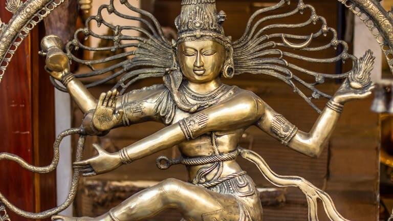 Close-up of a detailed bronze Nataraja statue representing the Hindu god Shiva's cosmic dance.